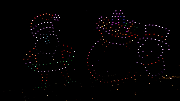 Santa and penguin made up of 400 drones