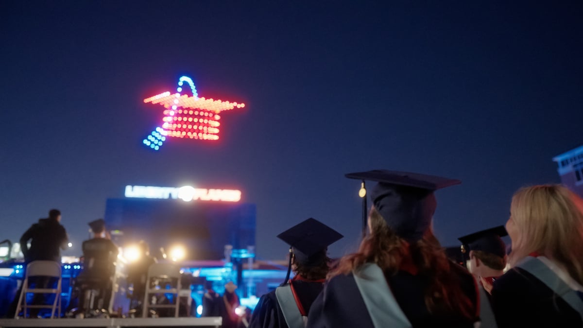 a drone show that shows a graduation cap seen by graduates