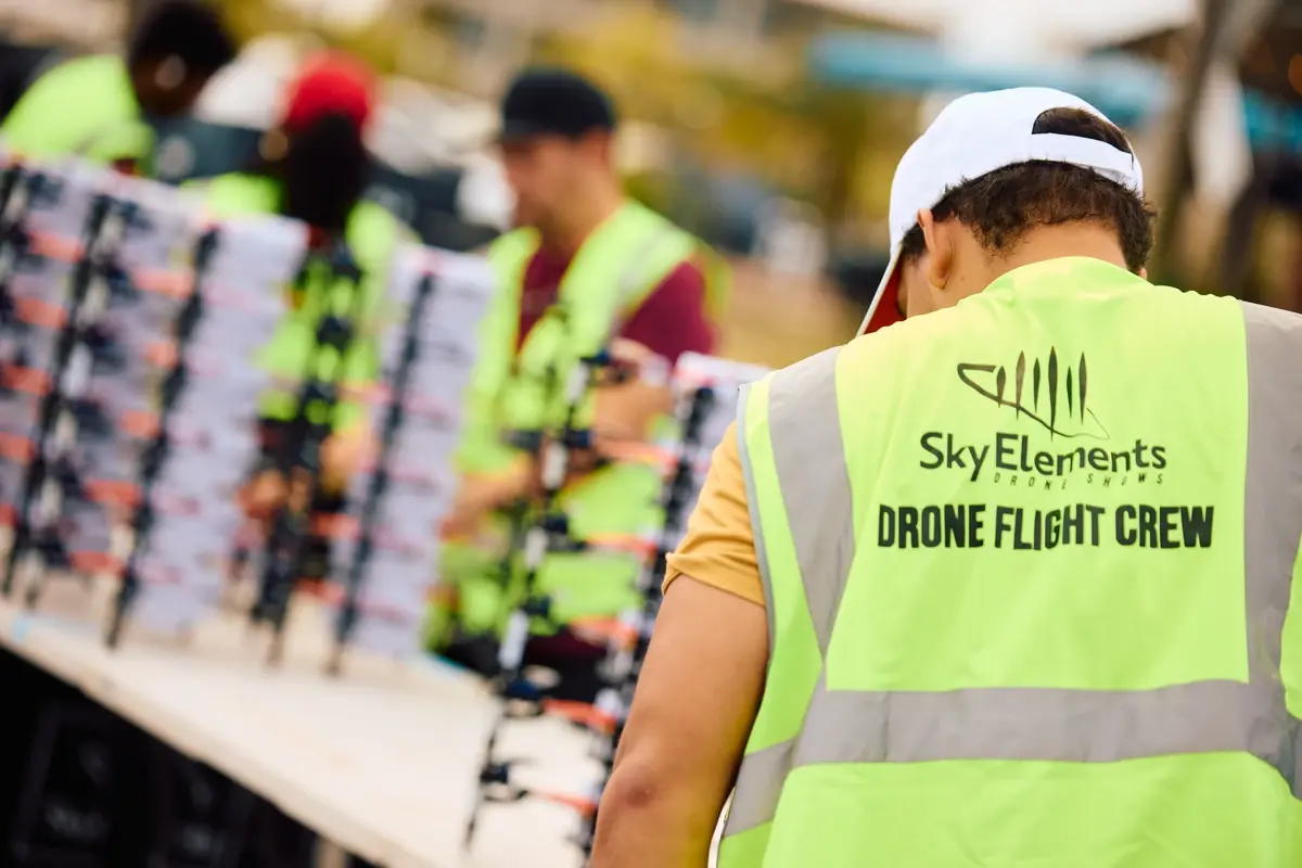 Sky Elements crew preparing drones before a show in Denver