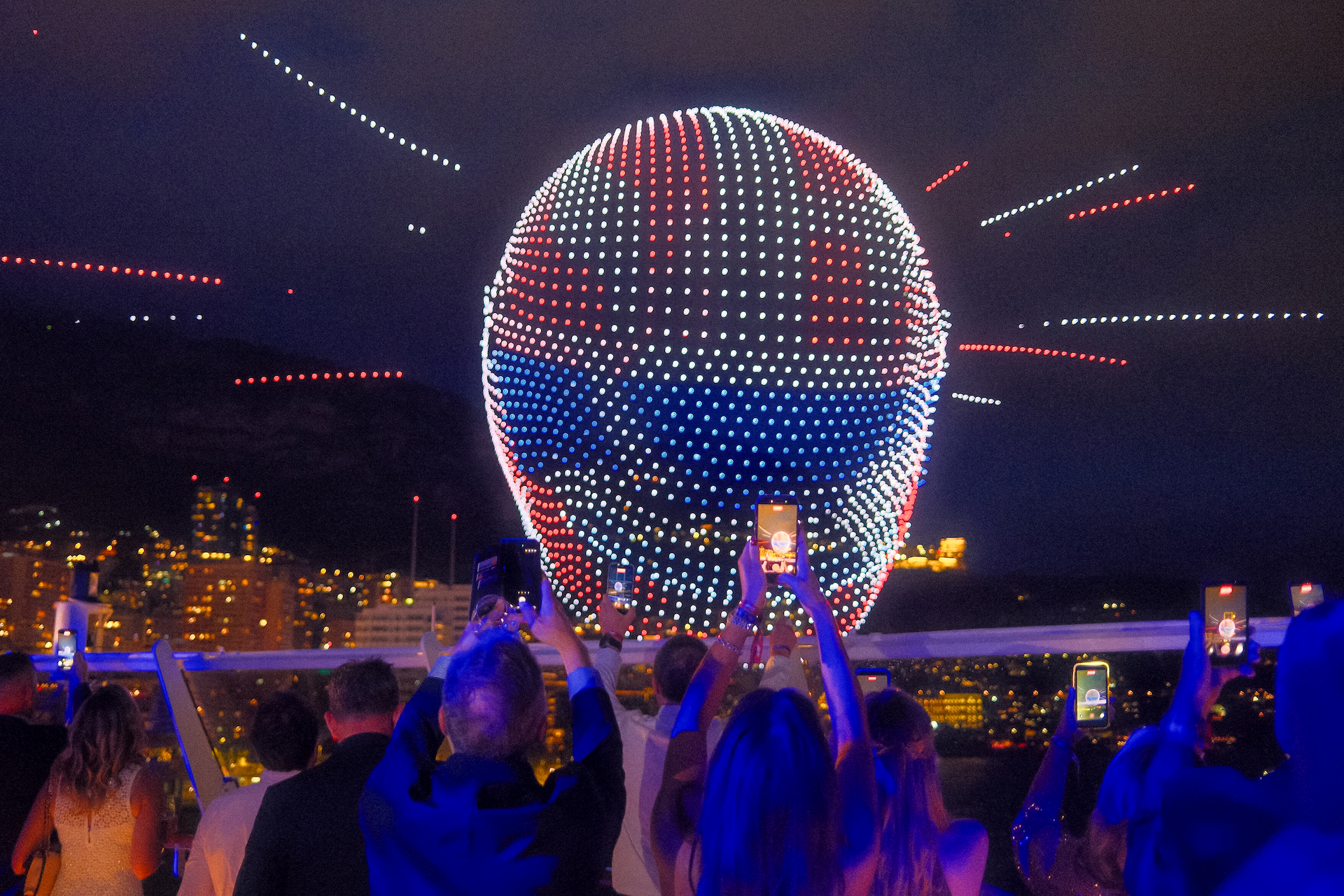 A vivid three-dimensional racing helmet rendered in drone light