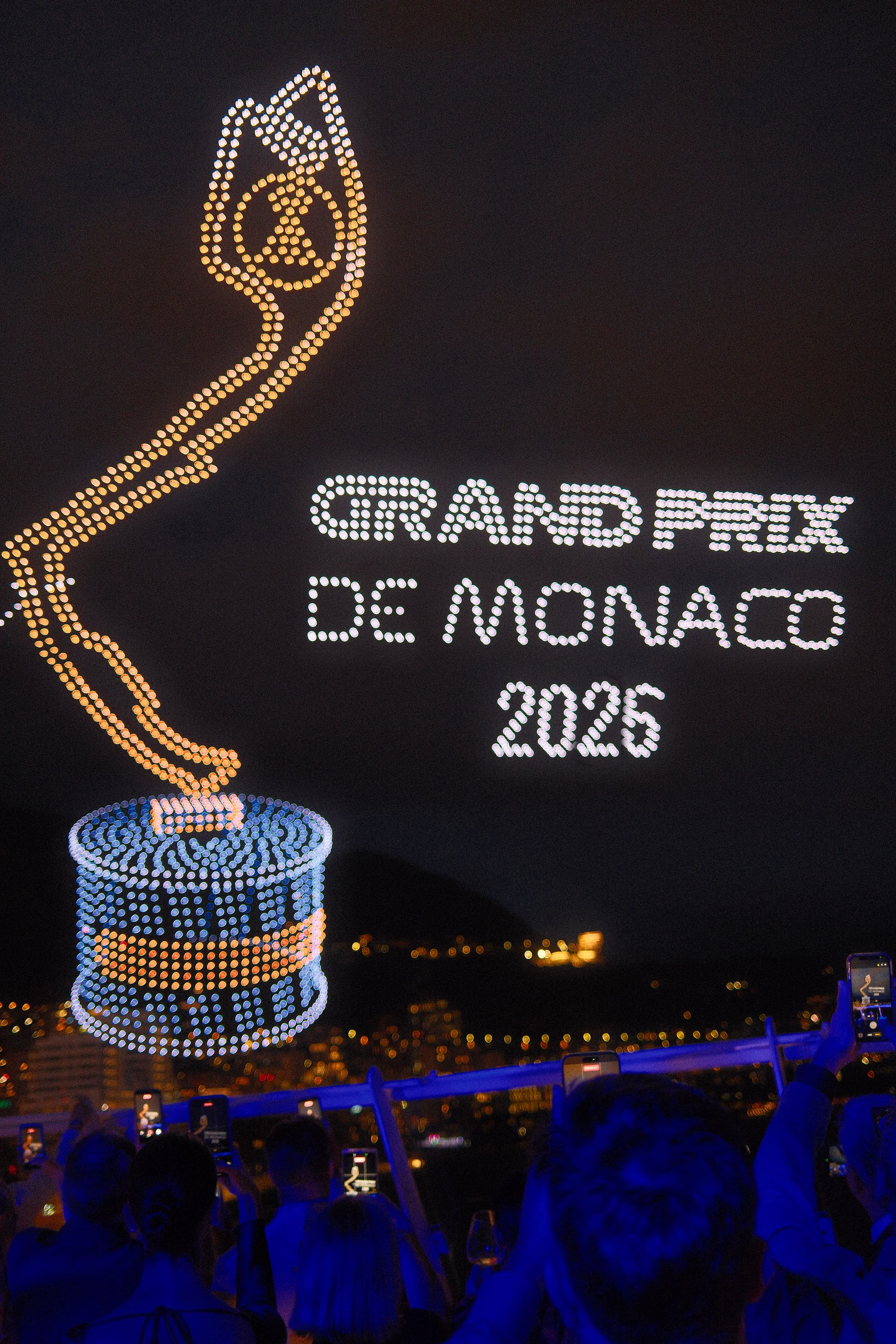 The Monaco Grand Prix trophy and Grand Prix de Monaco 2026 lettering in drone light