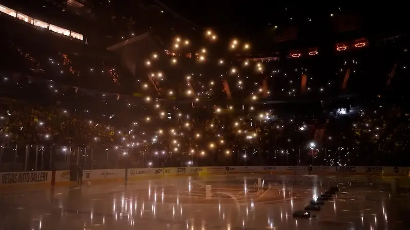 Drones forming over the ice above a packed NHL arena crowd