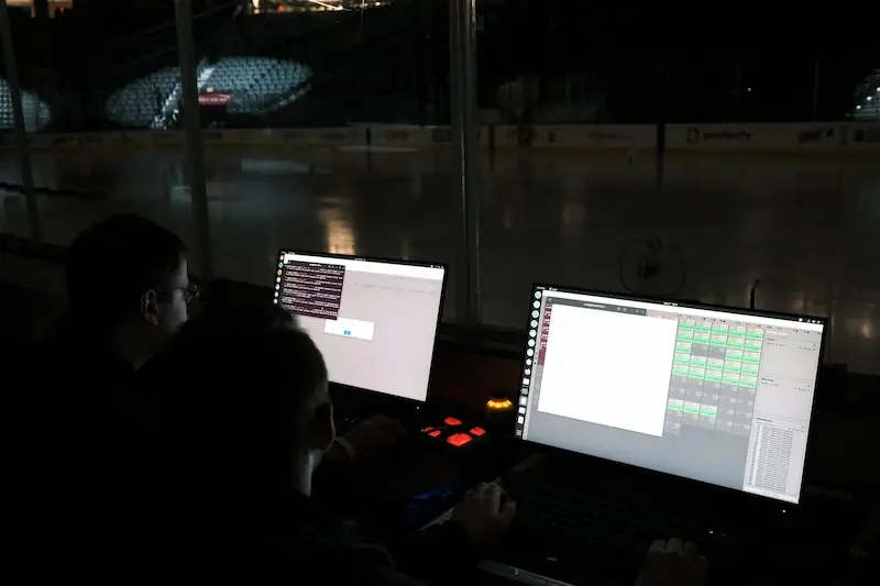 Sky Elements operators running the show from control screens at the arena