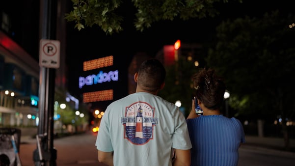 People look to see a drone show that read Pandora