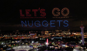 a drone show reading lets go nuggets in downtown Denver