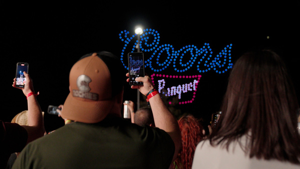 A Drone show shows the Coors Banquet logo