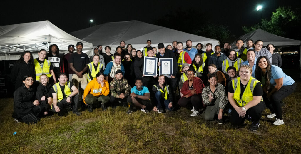 Sky Elements drone crew posing with two Guinness World Records